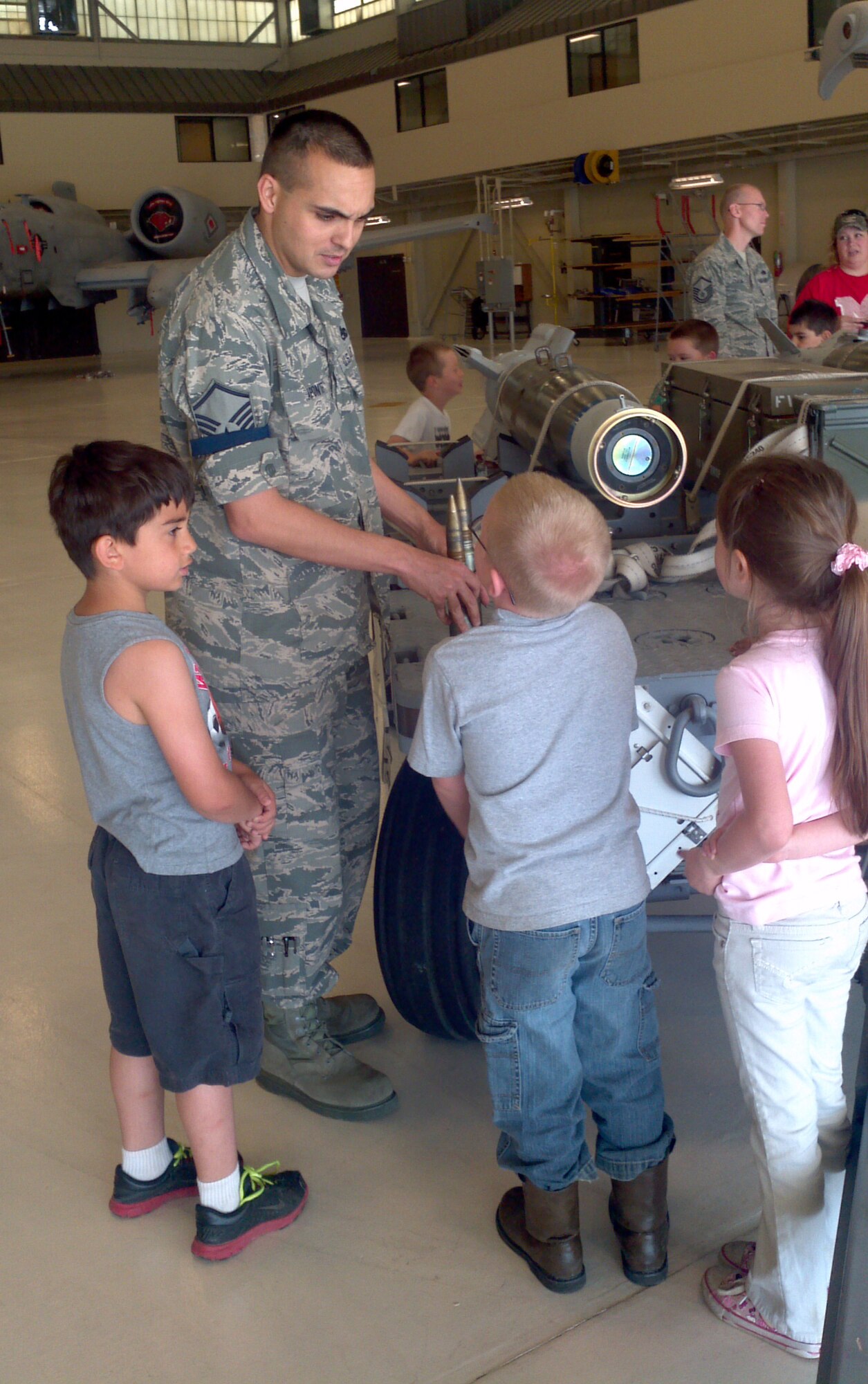 Master Sgt. Michael Aponte speaks to a group of first grade students from Mansfield Elementary School in Mansfield, Ark. The group toured the 188th Fighter Wing May 7, 2013. The group visited the hangar and got the chance to inspect one of the 188th’s A-10C Thunderbolt II “Warthogs.” The group also received a tour of the 188th Fire Emergency Services Flight. (U.S. Air National Guard photo by Maj. Heath Allen/188th Fighter Wing)