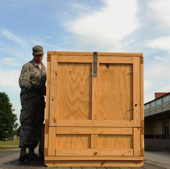 Senior Airman Jeff Dean, 2nd Logistics Readiness Squadron vehicle operator, checks a crate for abnormalities on Barksdale Air Force Base, La., May 7, 2013. The Vehicle Ops section helps further Barksdale's mission of delivering precision munitions to the battlefield by providing transportation for aircrew and shipping and receiving parts for aircraft. (U.S. Air Force photo/Airman 1st Class Benjamin Gonsier)