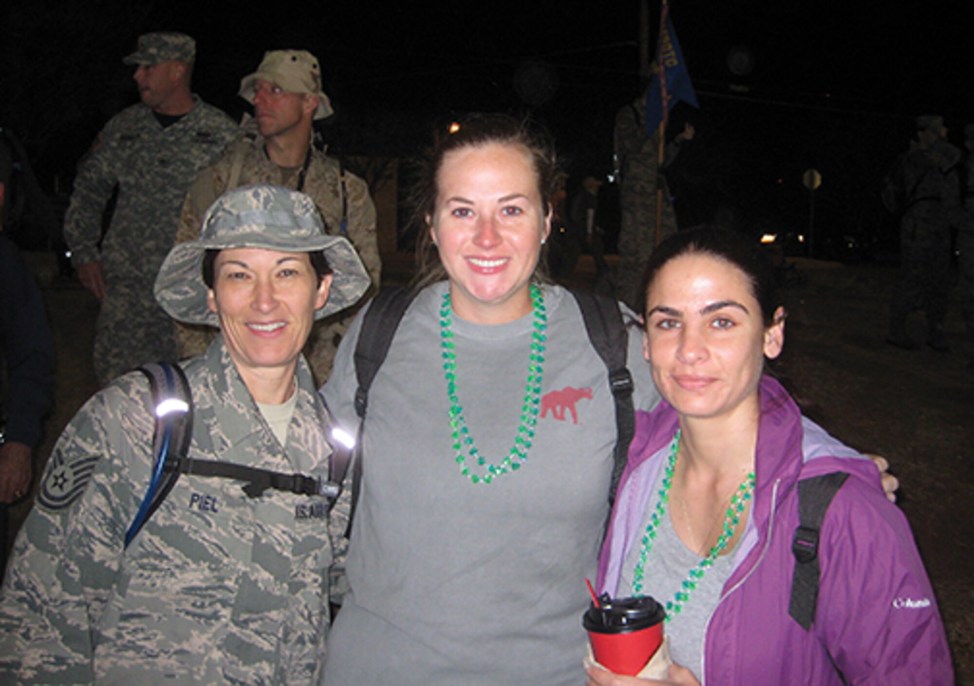 Tech. Sgt. Tracey Piel, Staff Sgt. Veronica Natal and Abby Helton wait for the start of the event.