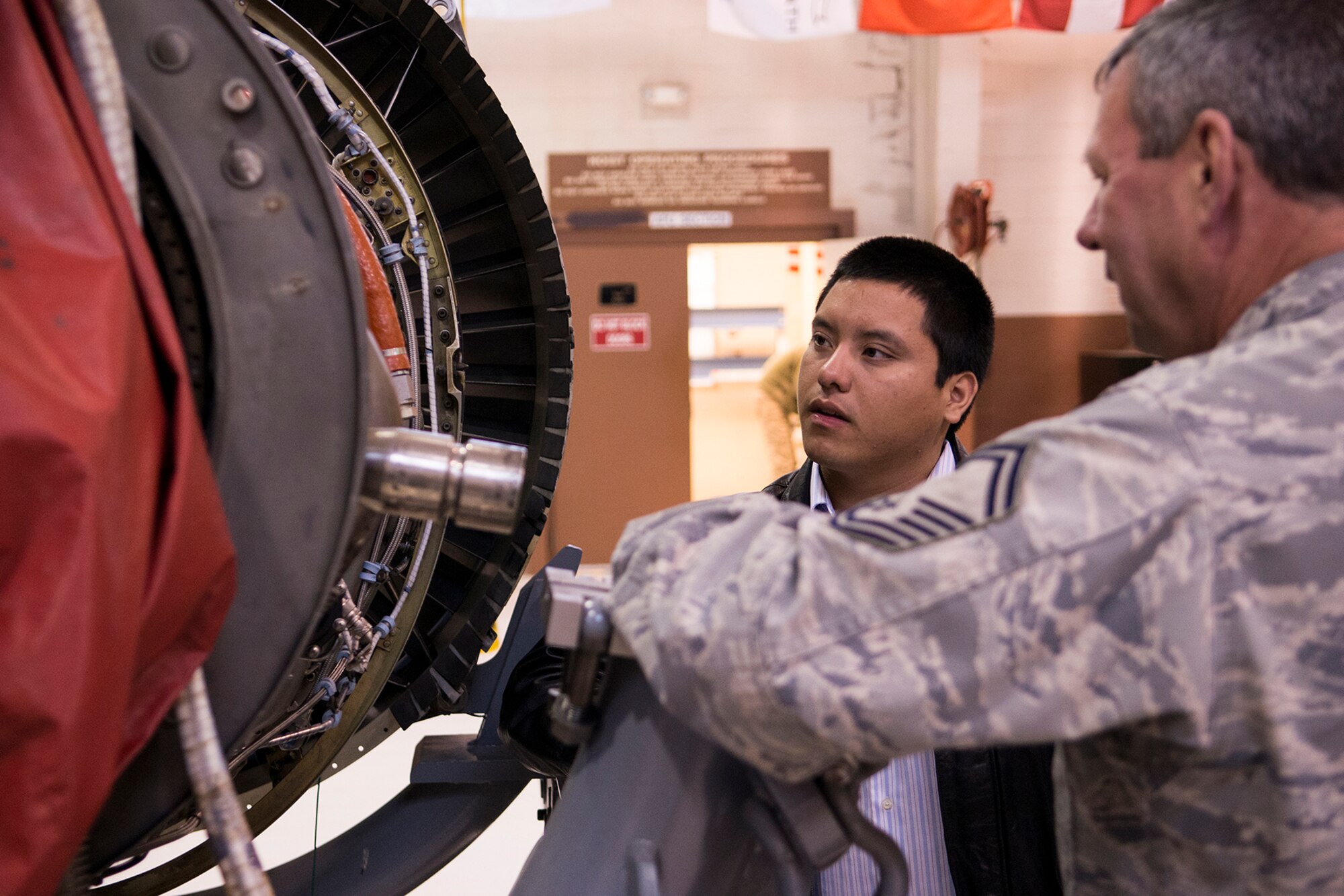 Erik Lopez gets an up close look at a jet engine during a tour on May 3, 2013, Barksdale Air Force Base, La. Lopez is a college sophomore at the University of Illinois and was accepted for an internship with NASA's Jet Propulsion Laboratory. (U.S. Air Force photo by Master Sgt. Greg Steele/Released)