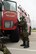 A U.S. Airman with the Rosecrans Fire Department, Missouri Air National Guard, exits a fire truck during Task Qualification Training (TQT) at Rosecrans Air National Guard Base, Mo., May 4, 2013. The base conducted TQT to prepare for an operational readiness inspection next year which tests Airmen’s ability to survive and operate in a war time environment. (U.S. Air National Guard photo by Senior Airman Patrick P. Evenson/Released)