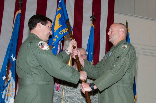 Brig. Gen. James C. Witham, Deputy Director, Air National Guard, the Pentagon, (left) passes the command flag to Col. Matthew J. Manifold, who will head the Air National Guard Air Force Reserve Command Test Center (AATC) at the 162nd Fighter Wing in Tucson, Ariz., May 3, 2013.  (U.S. Air National Guard photo by Master Sgt. Amie Neighbors/Released)
