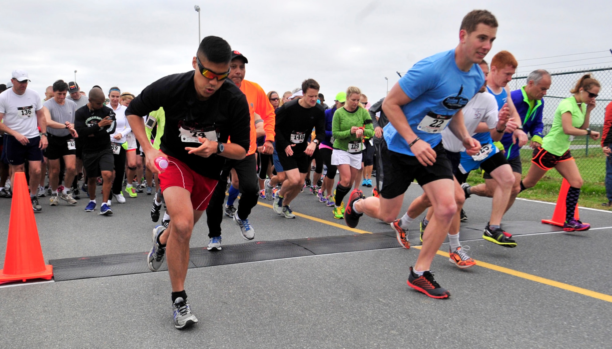 Runners take off at the starting line of the Heritage Half Marathon and 5K May 5, 2013, at the Air Mobility Command Museum on Dover Air Force Base, Del. Despite the cool temperatures, more than 200 competitors participated in the event. (U.S. Air Force photo/Tech. Sgt. Chuck Walker)