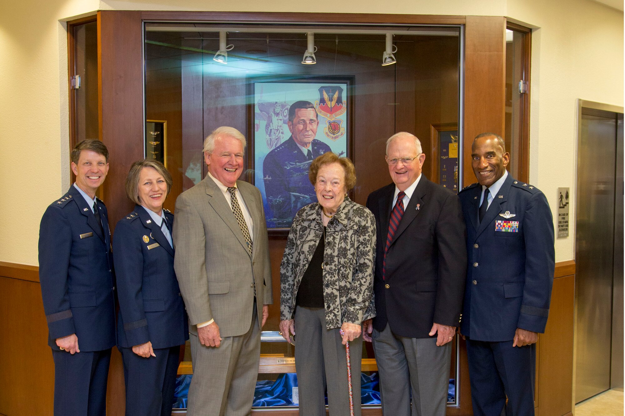 Air Force Personnel Center commander Maj. Gen. A.J. Stewart (far right) poses with Mrs. Kelly Dixon (center), wife of the late Gen. Robert J. Dixon, during a tour of the Dixon Heritage Hall Exhibit. Distinguished guests touring the exhibit also included (left to right) Lt. Gen. Darrell D. Jones, Deputy Chief of Staff for Manpower, Personnel and Services, Headquarters U.S. Air Force, Washington, D.C.; and retired former Air Force Personnel Center commanders Maj. Gen. K.C. McClain, Gen. Billy Boles, and Lt. Gen. Michael D. McGinty. (Air Force photo/Joshua Rodriguez)