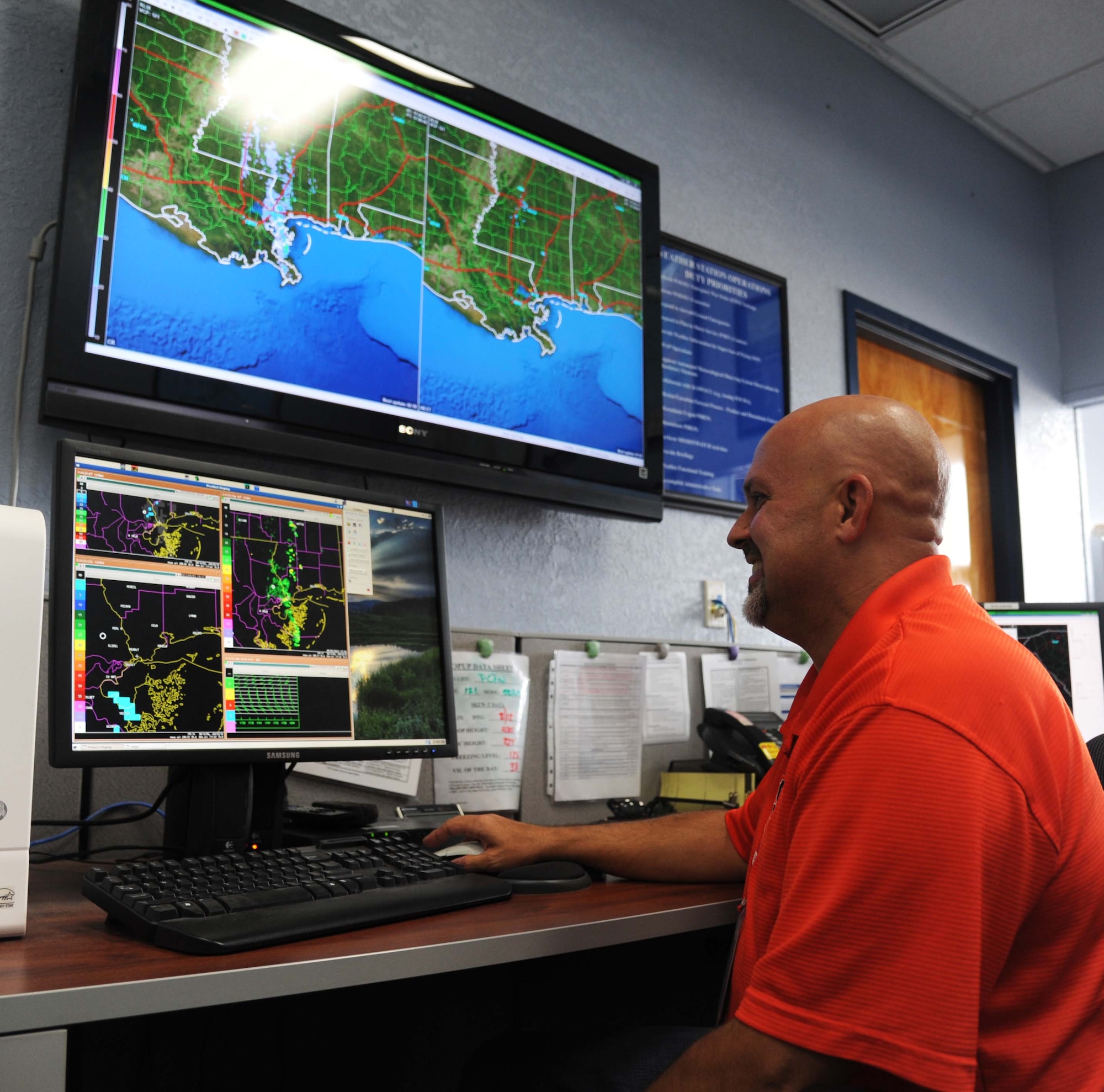 Jeffrey Light, 81st Operations Support Flight weather forecaster, views doplar radar images May 3, 2013, at base operations, Keesler Air Force Base, Miss.  Airfield Operators perform and manage airfield operations functions and activities including air traffic control, airfield management, and base operations to facilitate the flying mission at their base. They provide staff supervision and technical assistance, as well as develop and formulate plans and policies for managing and operating Air Force airfield operations.  (U.S. Air Force photo by Kemberly Groue)