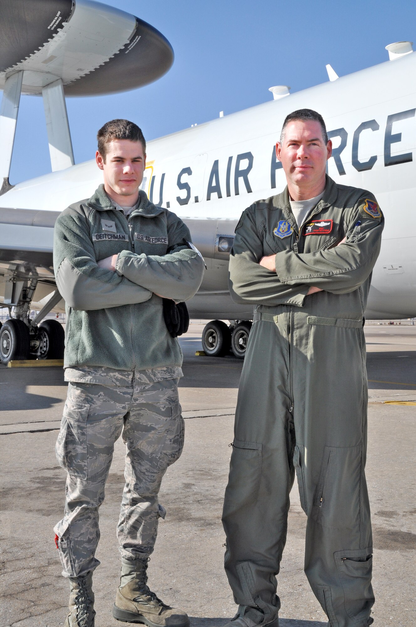 Master Sgt. Frank Deitchman (right) and Airman 1st Class Dennis Deitchman are a father-son team working on the E-3 Sentry.  Frank works as a Reserve member in the 513th and son Dennis is serving on active duty in the 552nd Aircraft Maintenance Squadron.  (U.S. Air Force photo by Staff Sgt. Caleb Wanzer)