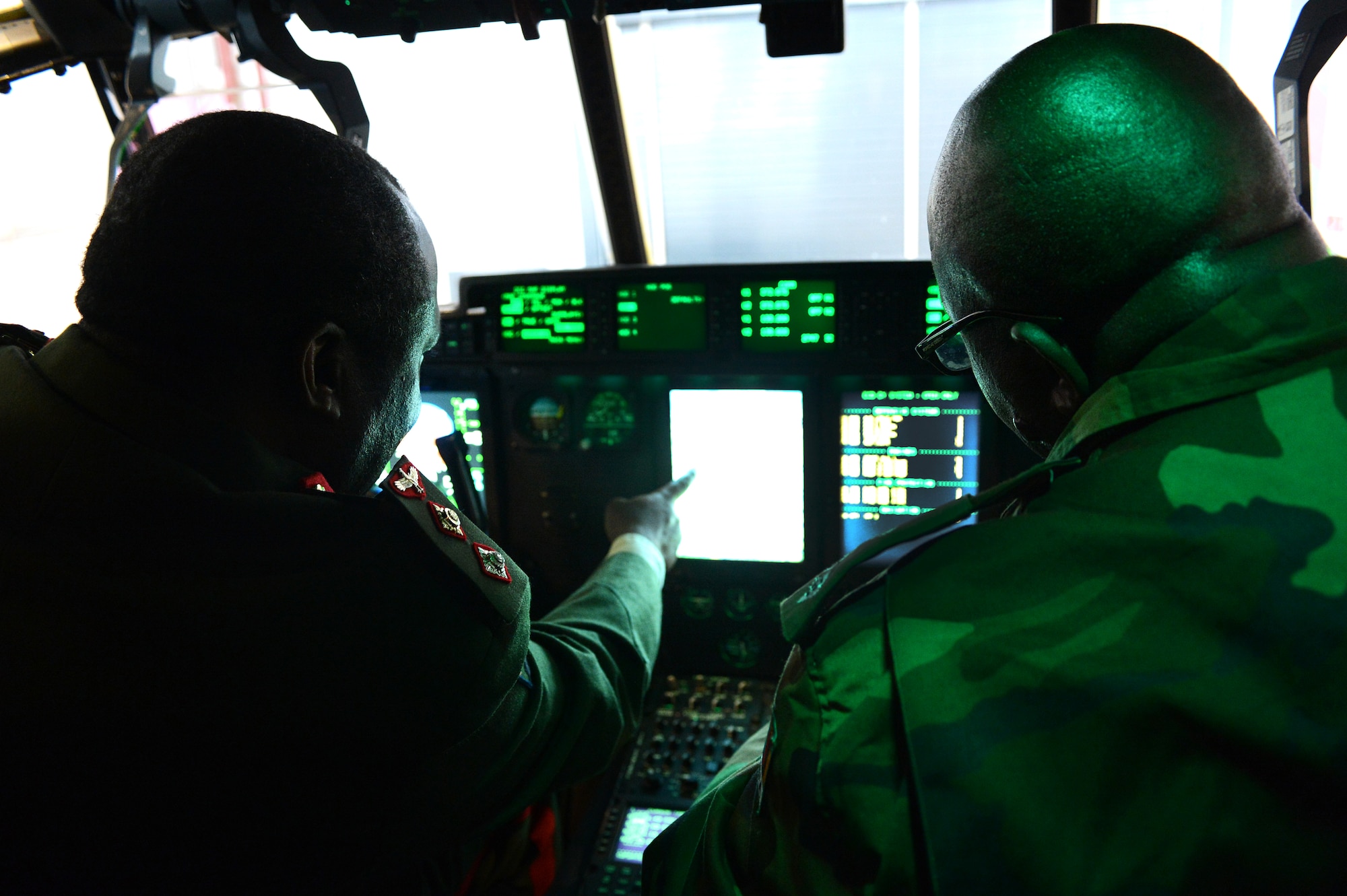 Members of the Zambian air force tour a C-130 J Super Hercules flight deck, April 29, 2013, Ramstein Air Base, Germany. The visit gave the Zambian air force a chance to further military relations and improve the partnership between the U.S. and Zambian air forces. (U.S. Air Force photo/Senior Airman Caitlin O’Neil-McKeown)