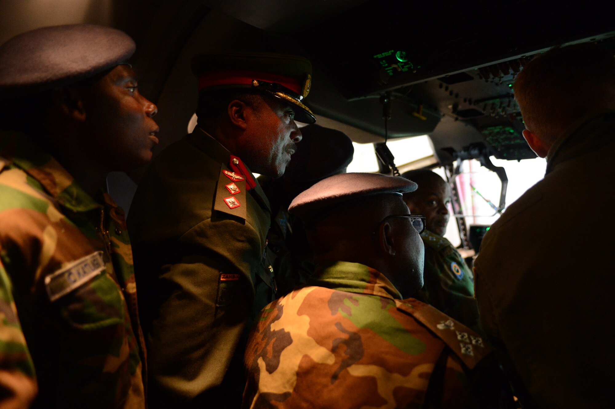 Lt. Gen. Eric Chimese, Zambian air force commander, along with a team of senior military officials tour a C-130 J Super Hercules flight deck, April 29, 2013, Ramstein Air Base, Germany. The visit gave the Zambian air force a chance to further military relations and improve the partnership between the U.S. and Zambian air forces. (U.S. Air Force photo/Senior Airman Caitlin O’Neil-McKeown)