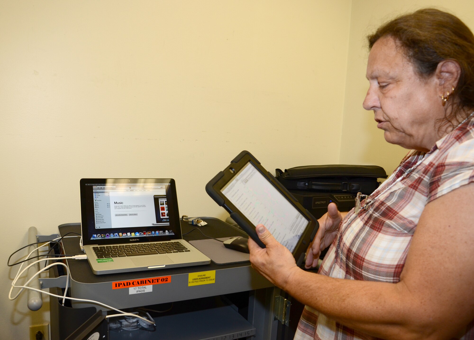 Rebecca Mitchell, 920th Rescue Wing Technical Order Distribution Office, is responsible for training maintainers and updating the wing?s 37 iPads with software that replaces paper/laptop-based technical orders used daily for aircraft maintenance work. The 920th RQW is among the first units to use this technology. (U.S. Air Force photo/2nd Lt. Leslie Forshaw)