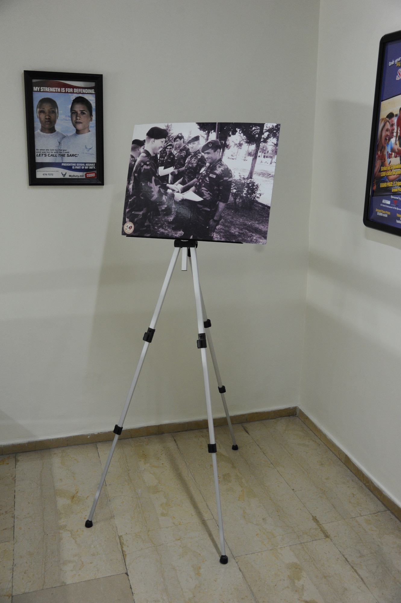 A poster board celebrating the 50th anniversary of Incirlik Air Base that took place in 2005 sits at the top of a flight of stairs in the 39th Air Base Wing headquarters building at Incirlik Air Base, Turkey, May 2, 2013. Local sources have confirmed this picture has been on display for the past eight years. (U.S. Air Force photo by 1st Lt. David Liapis/Released)