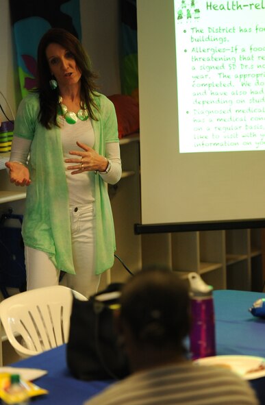 Michelle Henrich, Badger Clark Elementary School principal, provides information regarding BCES’s attendance policy during an educational workshop in the Child Development Center at Ellsworth Air Force Base, S.D., May 2, 2013. The 28th Force Support Squadron School Liaison Office hosted the workshop to help parents enroll their children into kindergarten. (U.S. Air Force photo by Airman 1st Class Hrair H. Palyan/Released)