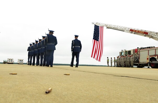 Shaw Air Force Base Honor Guard members finish performing a 3-volley rifle salute during a memorial held for Capt. James Steel, 77th Fighter Squadron pilot, in Hangar 1200 at Shaw AFB, S.C., April 30, 2013. More than 450 people attended the memorial. Steel passed away when his F-16 Fighting Falcon crashed in Afghanistan April 3, 2013. (U.S. Air Force photo by Senior Airman Tabatha Zarrella/Released)