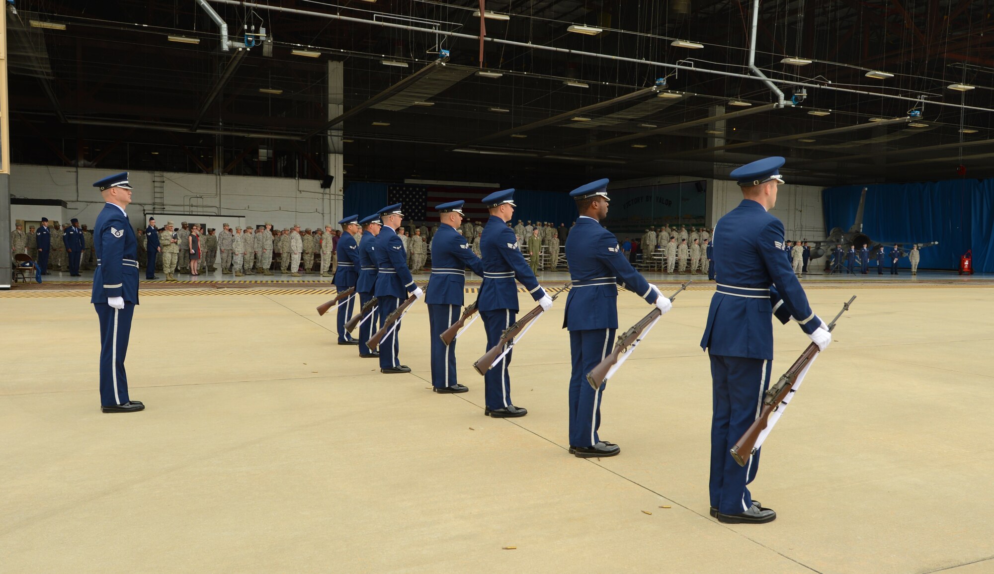 Shaw Air Force Base Honor Guard members perform a 3-volley rifle salute during a memorial held for Capt. James Steel, 77th Fighter Squadron pilot, in Hangar 1200 at Shaw AFB, S.C., April 30, 2013. More than 450 people attended the memorial. Steel passed away when his F-16 Fighting Falcon crashed in Afghanistan April 3, 2013. (U.S. Air Force photo by Senior Airman Tabatha Zarrella/Released)
