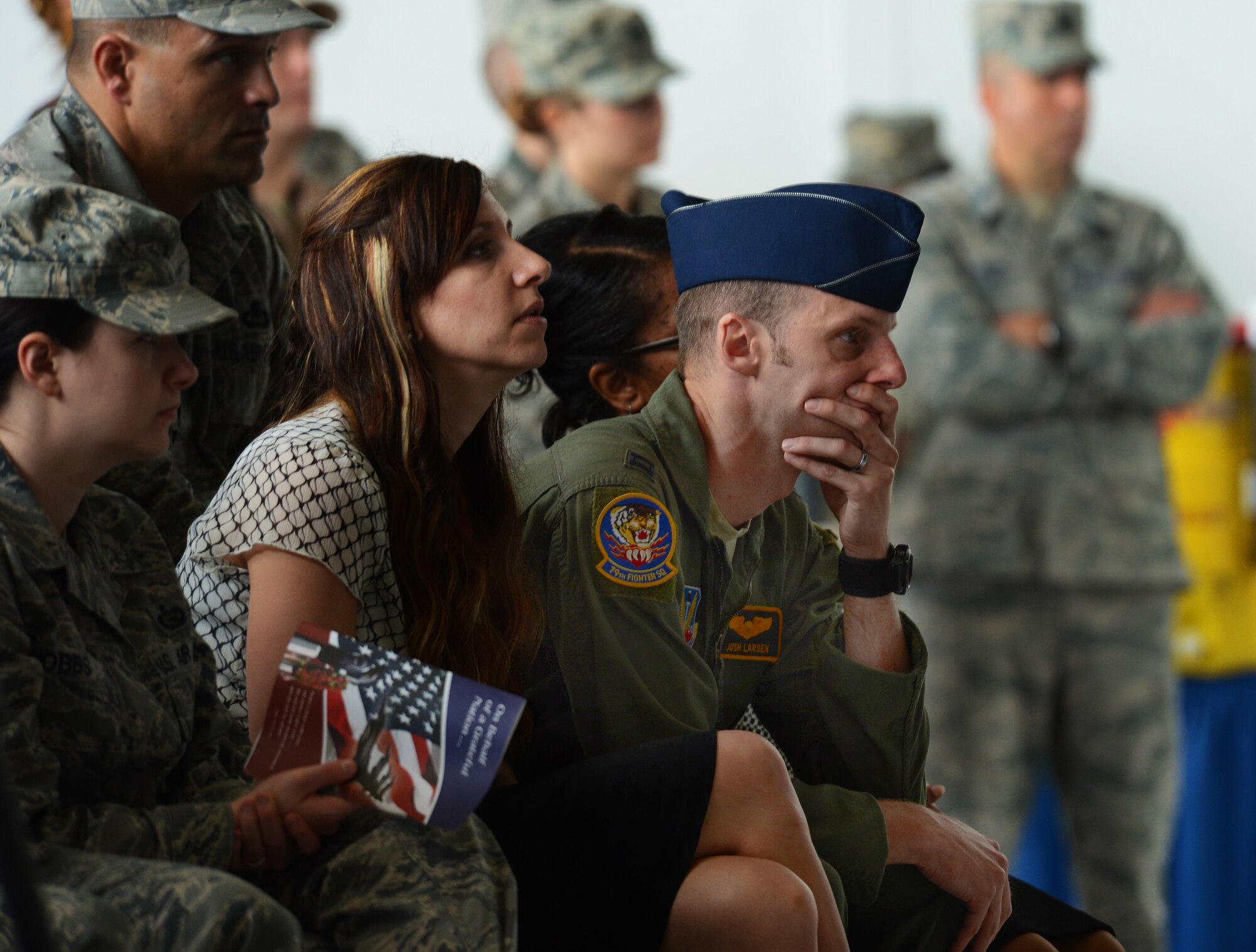Family members, friends, co-workers mourn for Capt. James Steel, 77th Fighter Squadron pilot, during his memorial in Hangar 1200 at Shaw Air Force Base, S.C., April 30, 2013. More than 450 people attended the memorial. Steel passed away when his F-16 Fighting Falcon crashed in Afghanistan April 3, 2013. (U.S. Air Force photo by Senior Airman Tabatha Zarrella/Released)
