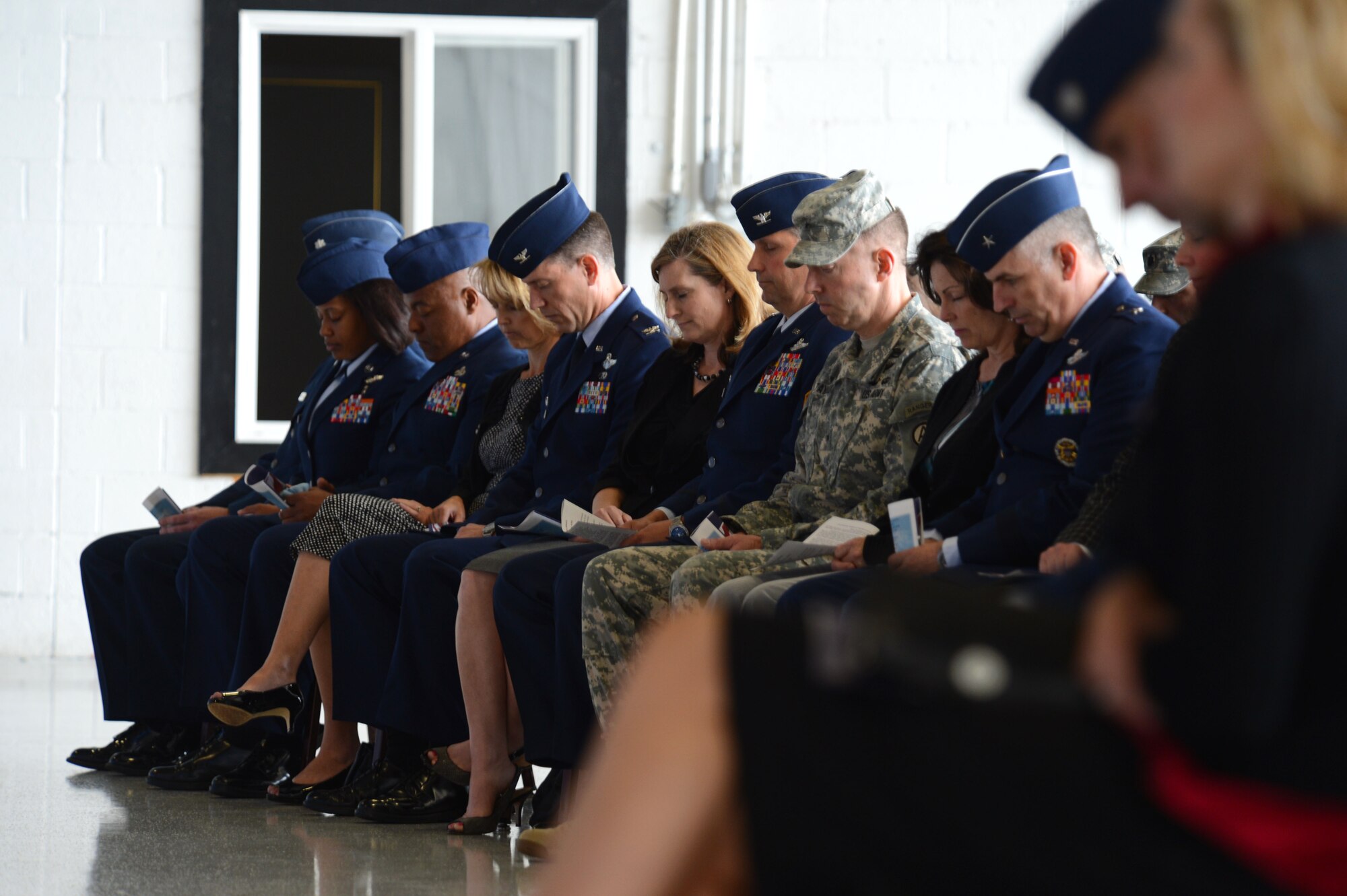 Shaw leaders bow their heads during a prayer at a memorial ceremony at Shaw Air Force Base, S.C., April 30, 2013.  The memorial ceremony commemorated the life and accomplishments of Capt. James Steel, 77th Fighter Squadron pilot, who died in an F-16 Fighting Falcon aircraft accident, while deployed to Afghanistan.  (U.S. Air Force photo by Airman 1st Class Nicole Sikorski/Released)
