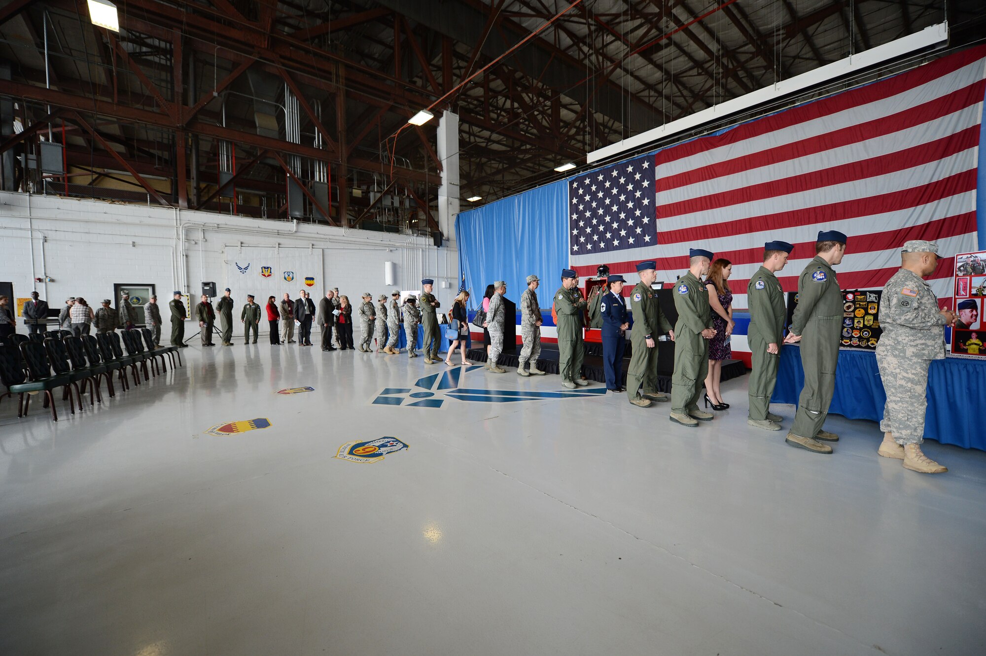 Family, friends and service members view a display of career achievements at a memorial ceremony at Shaw Air Force Base, S.C., April 30, 2013.  The memorial ceremony commemorated the life and accomplishments of Capt. James Steel, 77th Fighter Squadron pilot, who died in an F-16 Fighting Falcon aircraft accident, while deployed to Afghanistan.  (U.S. Air Force photo by Airman 1st Class Nicole Sikorski/Released)