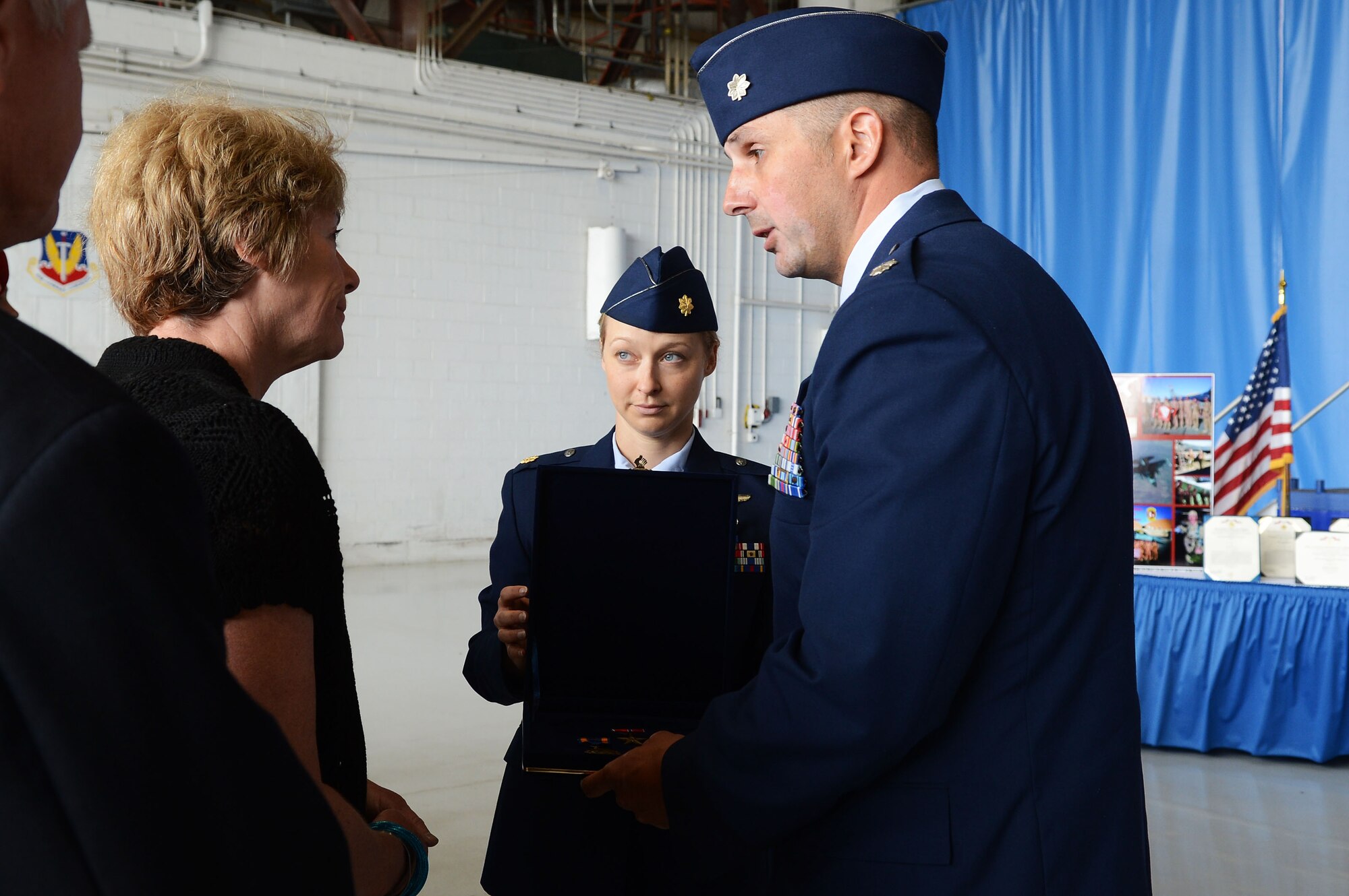 U.S. Air Force Lt. Col. Johnny Vargas, 77th Fighter Squadron commander hands a medal to the mother of Capt. James Steel, 77th Fighter Squadron pilot, during a memorial ceremony at Shaw Air Force Base, S.C., April 30, 2013.  The memorial ceremony commemorated the life and accomplishments Steel, who died in an F-16 Fighting Falcon aircraft accident, while deployed to Afghanistan.  (U.S. Air Force photo by Airman 1st Class Nicole Sikorski/Released)
