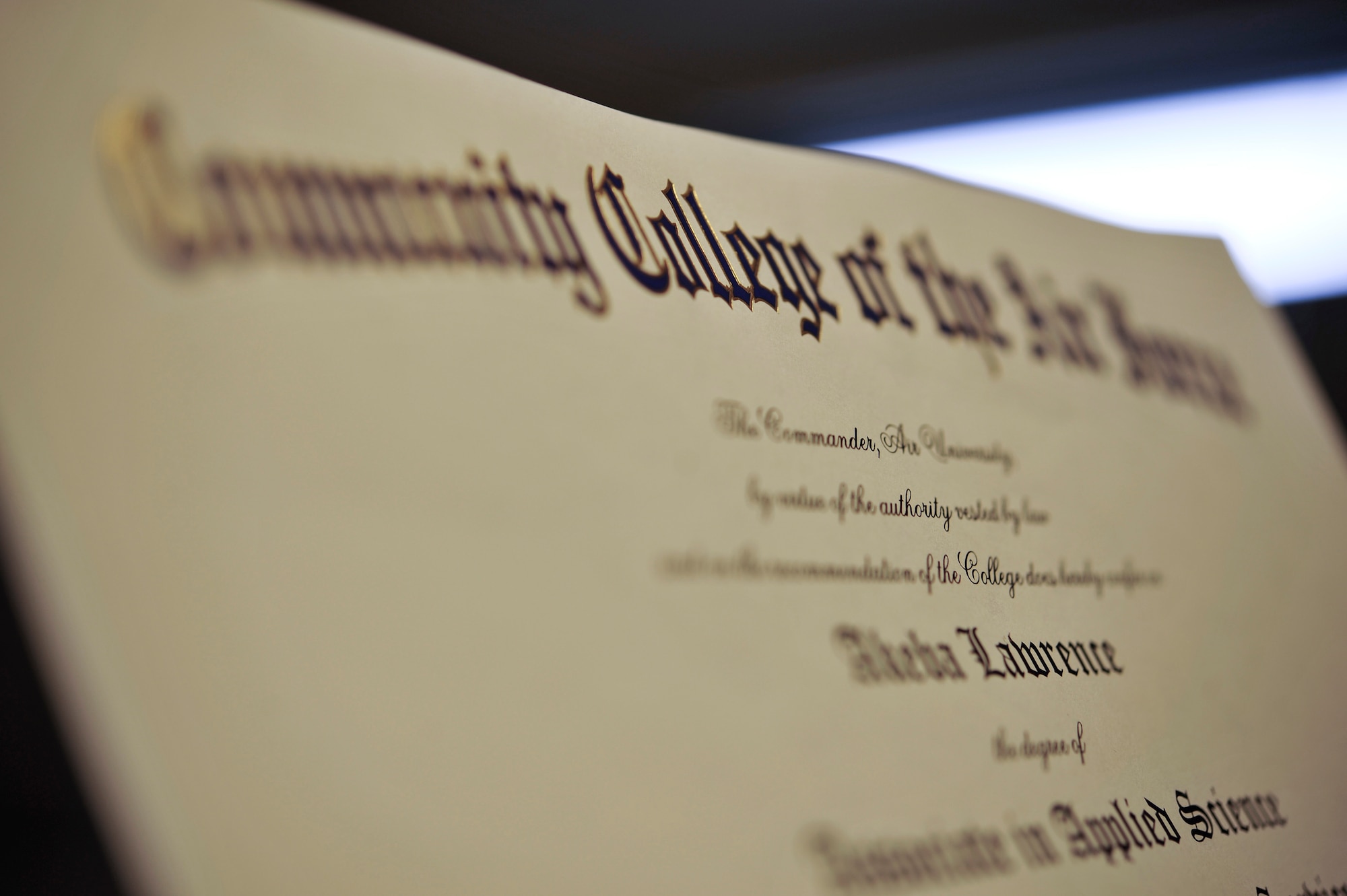 During the spring Community College of the Air Force graduation, 310 Airmen recieved their CCAF, May 3, 2013, Ramstein Air Base, Germany. This class is the largest class to graduate on Ramstein. Airmen receiving degrees. (U.S. Air Force photo illustration/Airman 1st Class Trevor Rhynes)