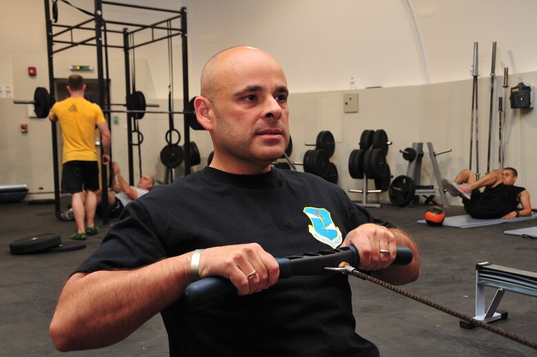 U.S. Air Force Master Sgt. Shane Sullivan, 380th Air Expeditionary Wing Equal Opportunity officer, works out on a rowing machine May 2, 2013, while deployed to Southwest Asia. Sullivan lost more than 40 pounds, scored a 99.8 on his fitness test and won the wing’s Biggest Loser contest. (U.S. Air Force photo by Staff Sgt. Timothy Boyer)