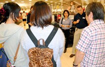 Mike Einer (second from right), main store manager for the Kadena Exchange, addresses local Japanese college students from Okinawa International University during their visit to the Kadena Exchange on Kadena Air Base, Japan,  May 3, 2013. The visit provided the business students the opportunity to learn about global marketing from the perspective of an American retail business. (U.S. Army photo by Sgt. 1st Class Jon Cupp/Released)