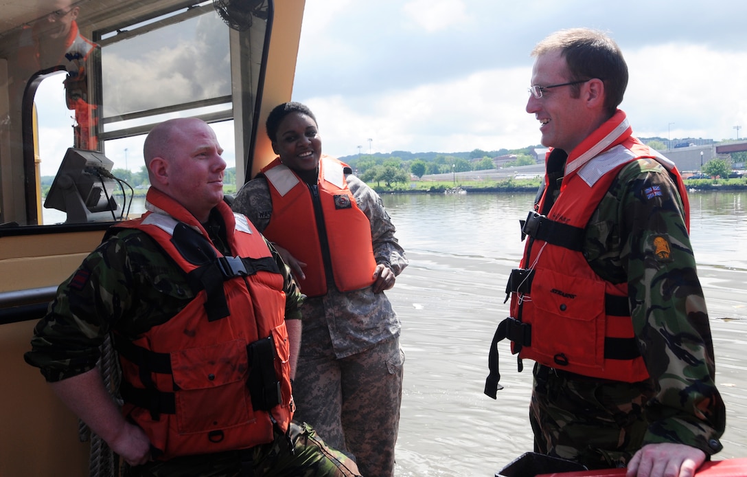 Capt. Matthew Fry (left), Sgt. 1st Class Solitaire Washington (center), and Maj. Robert Duke (right) board the U.S. Army Corps of Engineers, Baltimore District’s Debris Vessel 1 in Washington Harbor as part of an Officer’s Professional Development training. Photo by Brittany Bangert