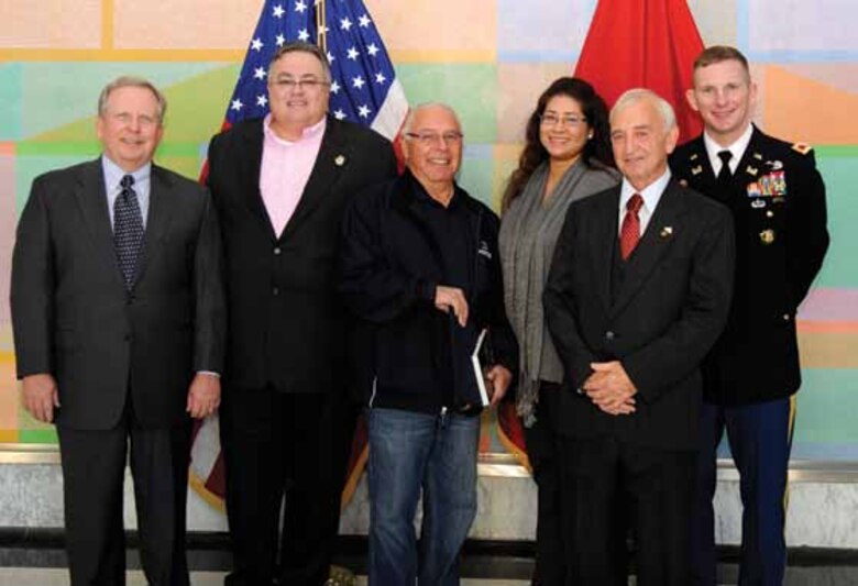 Left to Right, Robert Dunn, John Berrey, Quapaw tribal elder Ranny McWaters, Delaware Nation THPO Tamara Francis Fourkiller, Jimmy McNeil and Col. Vernie Reichling at the Programmatic Agreement signing Nov. 20, 2012.