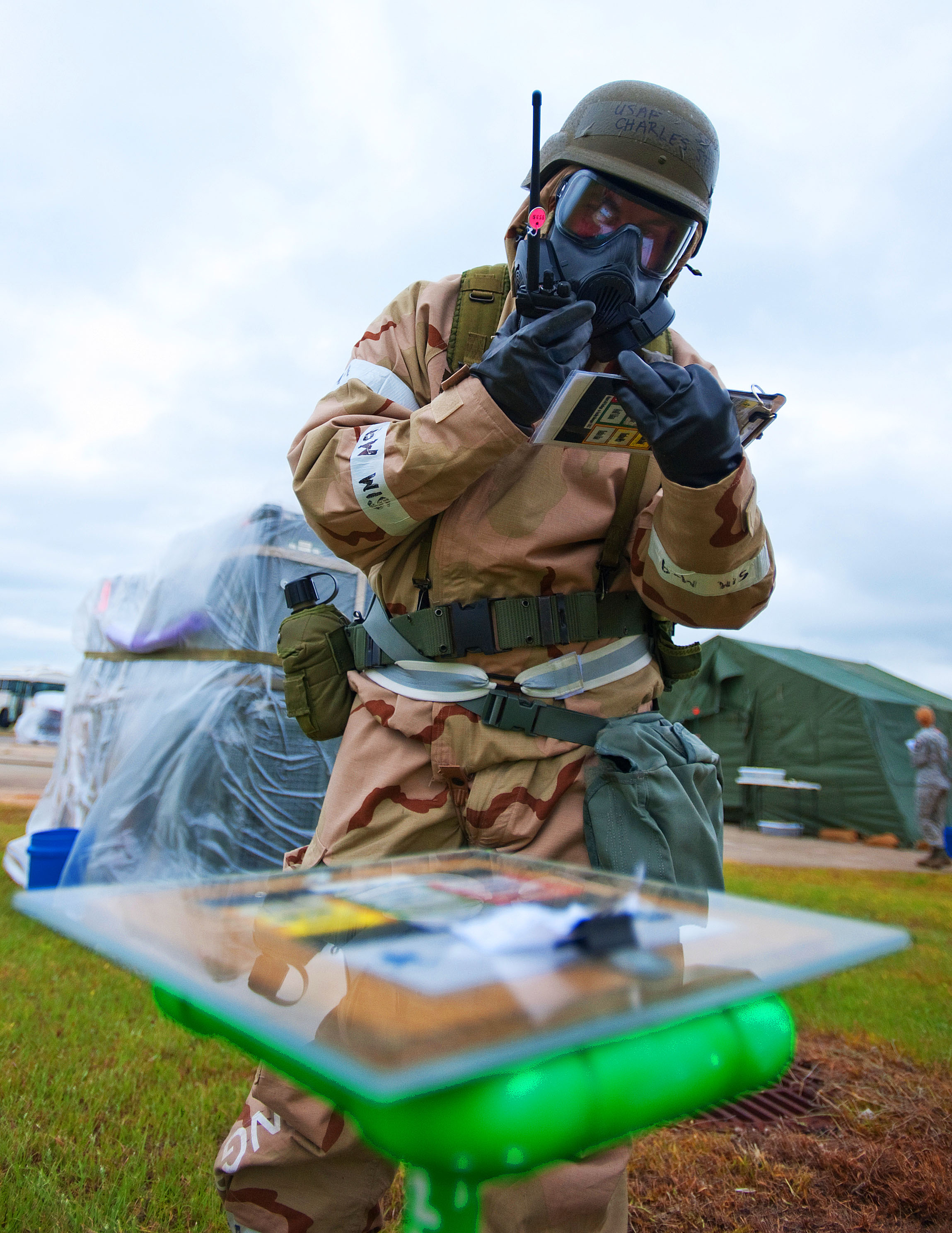 Air Force Staff Sgt. Charles Stoy call in a chemical detection during a