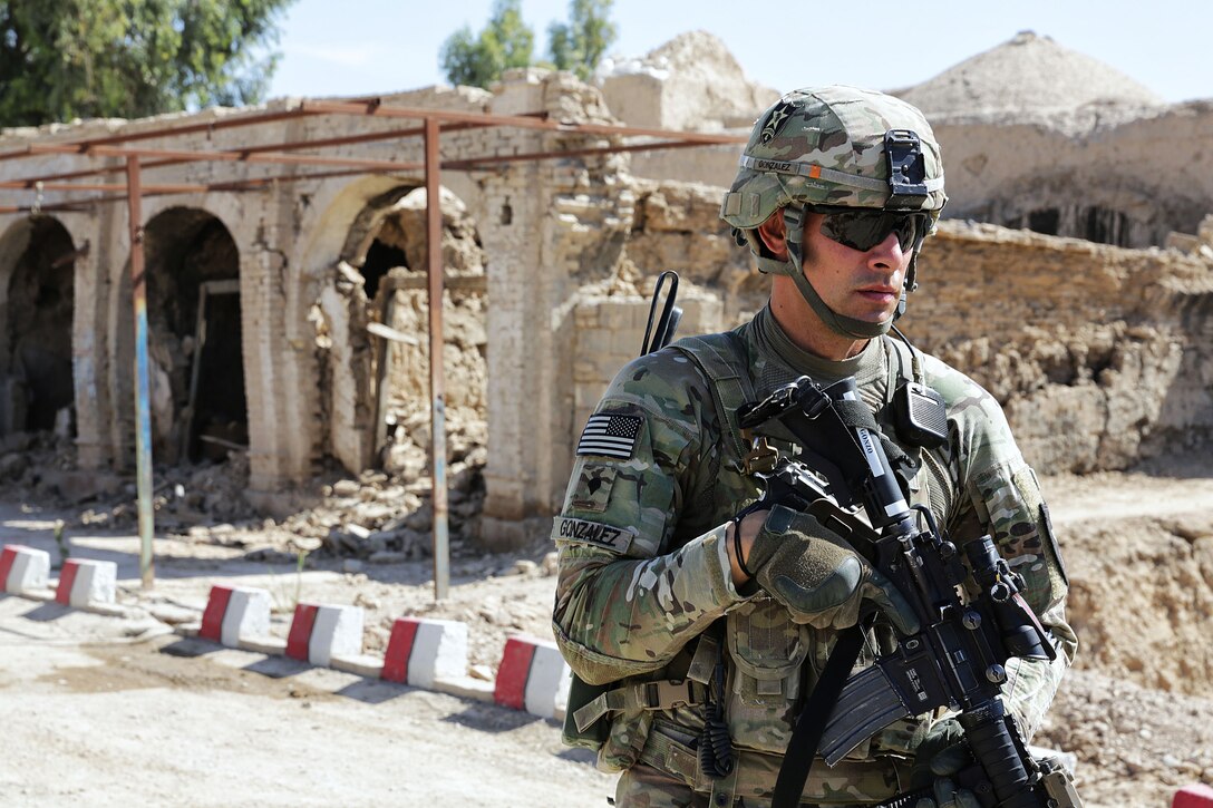 U.S. Army Spc. Joseph Gonzalez maintains security during a meeting with the Farah provincial chief justice in Farah City, Afghanistan, May 4, 2013. Gozalez is assigned to the Provincial Reconstruction Team Farah's security force.