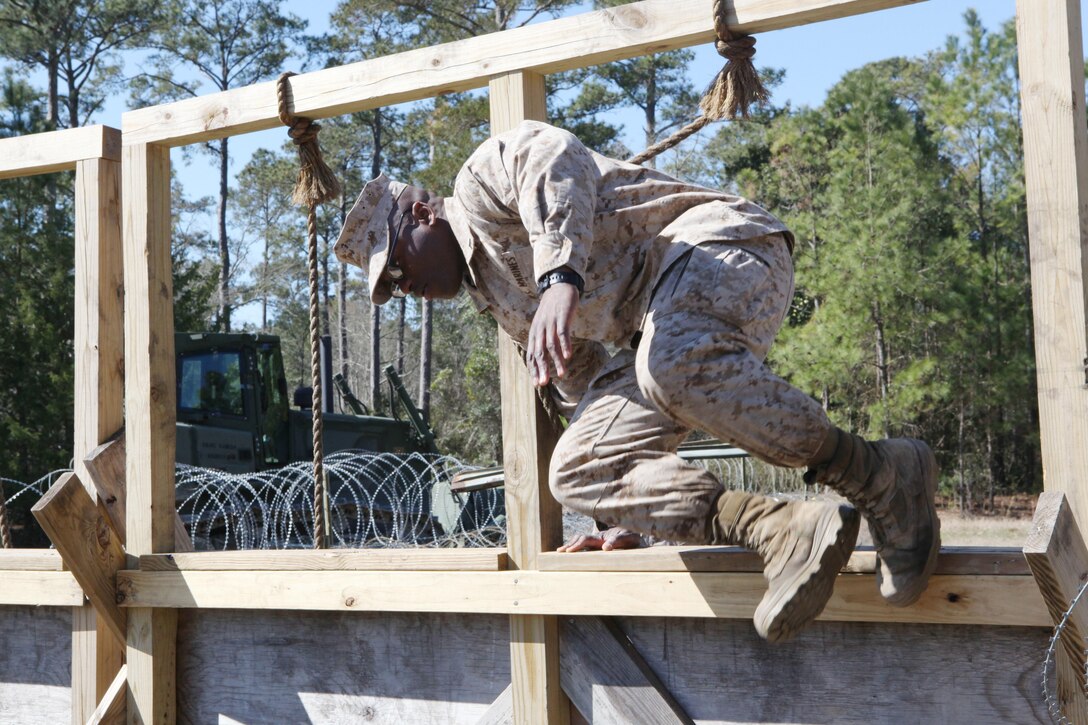 Students of Marine Corps Engineer School go through obstacles of the Engineers Course at Courthouse Bay aboard Marine Corps Base Camp Lejeune. They were there to add some finishing touches in a two-year restoration of the course.