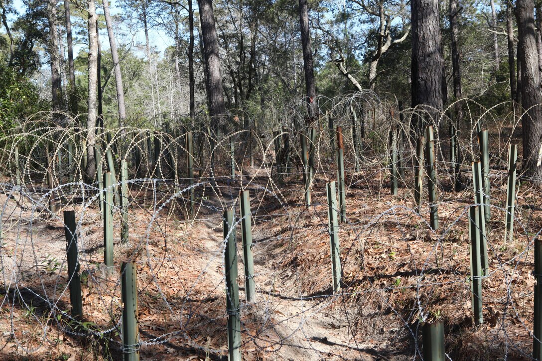 The Engineers Course at Courthouse Bay aboard Marine Corps Base Camp Lejeune contains varied obstacles and passes through mud, an area of barbed wire and a mock forward operating base all created by teachers and students at the Marine Corps Engineers School. The course was recently restored and modified by Gunnery Sgt. Peter Porter, an instructor with the Marine Corps Engineer School, his peers and students.