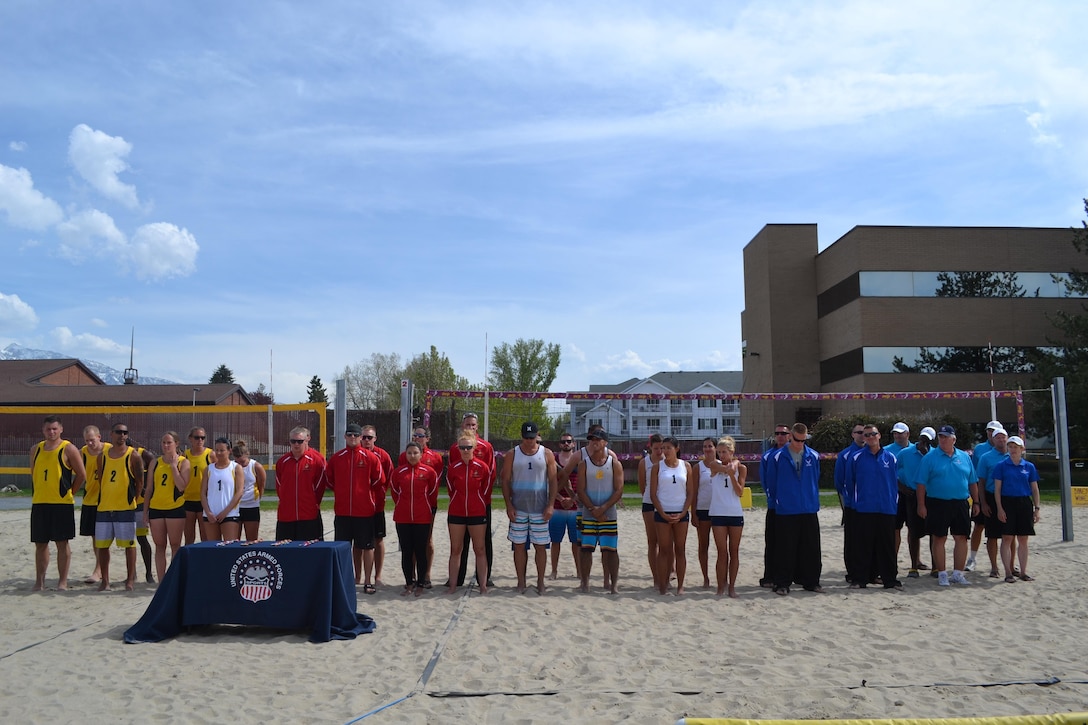 Teams from Army, Marines, Navy/Coast Guard, and Air Force line up at the closing ceremony of the 2013 Armed Forces Beach Volleyball Championship 2-6 May hosted by Hill AFB, UT.