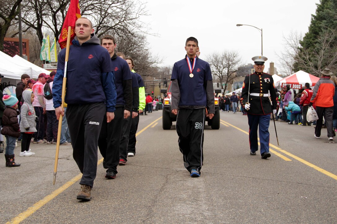 Recruiting Substation Woodbury's Sgt. Julio Gonzalez marches eight aspiring Marines in the Cinco de Mayo West Side St. Paul Parade May 4. For additional imagery from the event visit www.facebook.com/rstwincities.