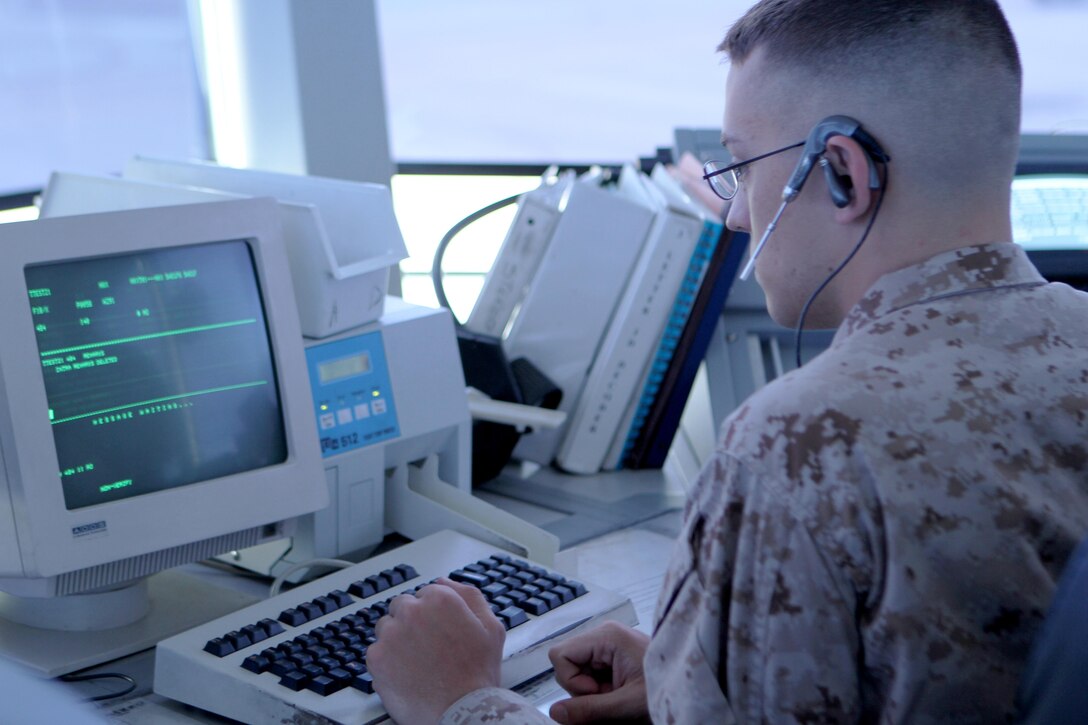 Pfc. Andrew Patterson, air traffic controller and a Pittsburgh native, retrieves flight data at the Air Traffic Control facility aboard Marine Corps Air Station Miramar, Calif. April 15. This position is aware of when aircraft arrives and departs, and enters it into the air traffic management system.