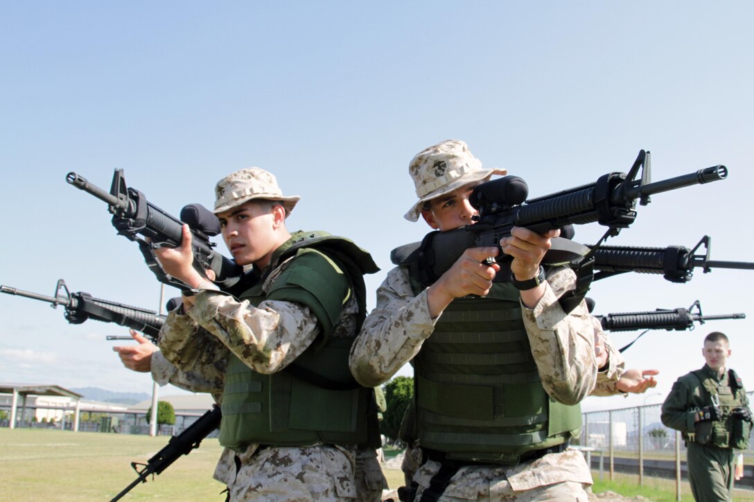 Station Provost Marshal's Office Marines provide security during a Special Reaction Team indoctrination, which took place at the Penny Lake fields here, May 2, 2013. A few Marines have the opportunity to attend the SRT school at Fort Leonard Wood, Mo., before actually trying to make a team.