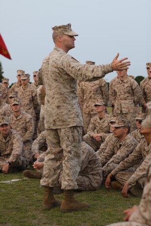 Sgt. Maj. Peter W. Ferral, Headquarters and Headquarters Squadron sergeant major, talks with H&HS servicemembers at the start of an overnight field exercise and field meet at Penny Lake field here April 18, 2013. The field meet consisted of several events which included the dizzy izzy, Humvee pull, pugil stick bouts and tug of war. At 9 p.m., all lights at the field were secured, with Marines sleeping with whatever provisions they brought in their packs.