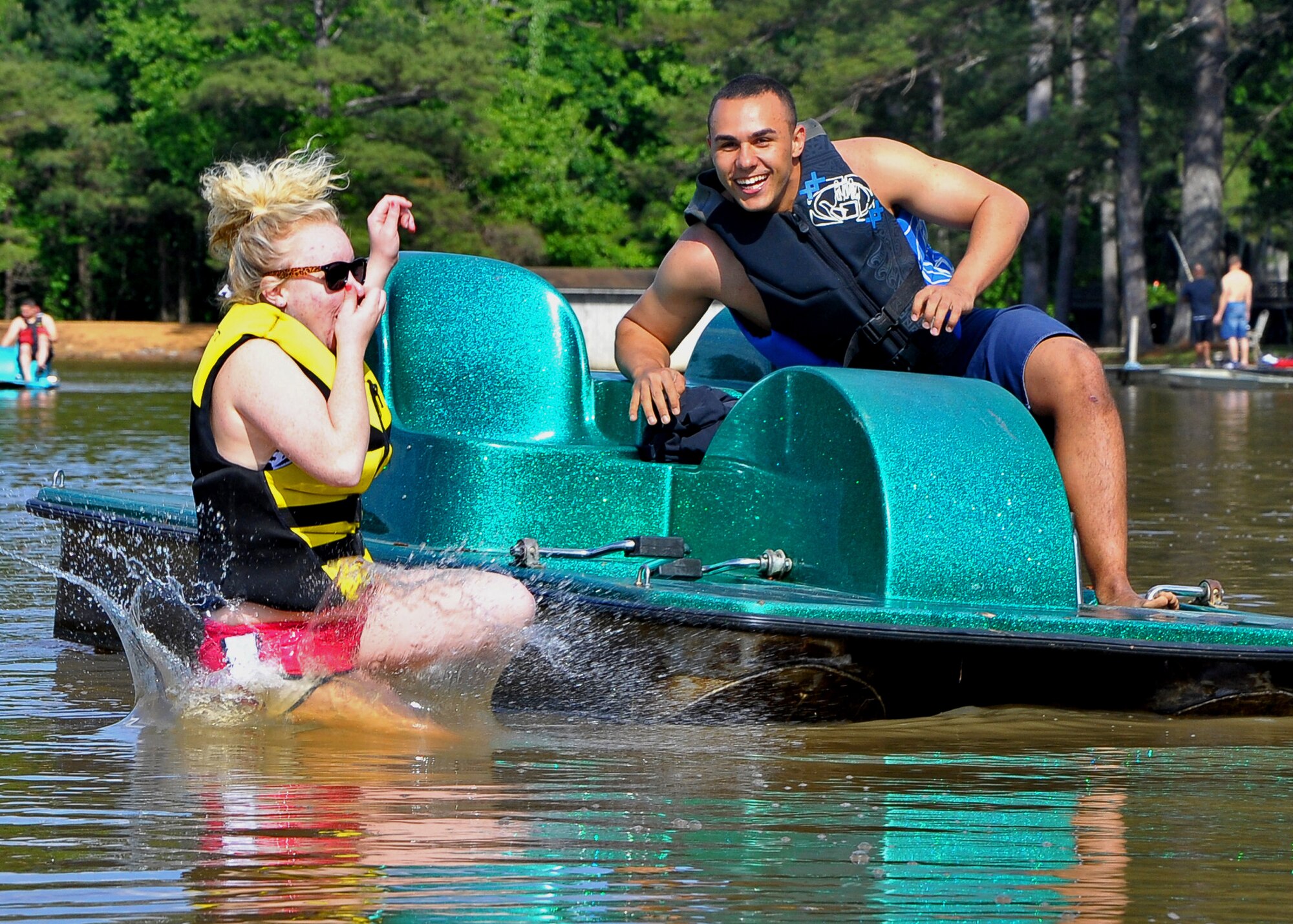 Airman 1st Class Heather Schoenberger, 14th Operations Group, goes for a dip in the lake at Lake Forest Ranch, Macon, Miss. courtesy of Airman 1st Class Cirrez Miller, 14th Medical Operations Squadron.  The enlisted dorms took part in a Single Airman’s Retreat hosted by the base chapel May 3-5 to promote camaraderie and resiliency.  (U.S. Air Force Photo/Airman 1st Class Stephanie Englar)