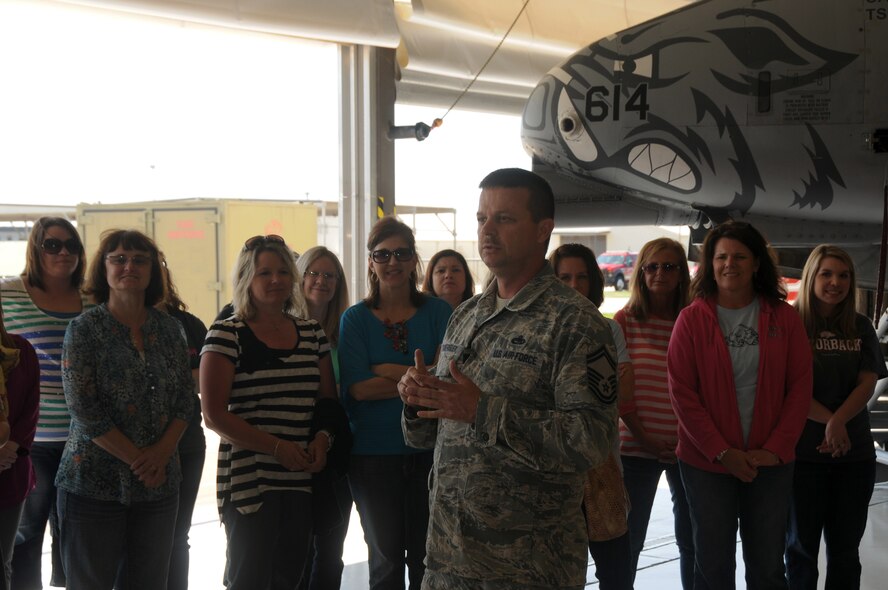 Senior Master Sgt. Dee Tankersley of the 188th Maintenance Group speaks to a group of teachers from Westwood Elementary in Greenwood, Ark. The teachers toured the 188th Fighter Wing April 29. They received a mission briefing from Lt. Col. Brian Burger, 188th Operations Group commander, and got the chance to learn about the A-10C Thunderbolt II “Warthogs.” (U.S. Air National Guard photo by Senior Airman John Hillier/188th Fighter Wing Public Affairs)