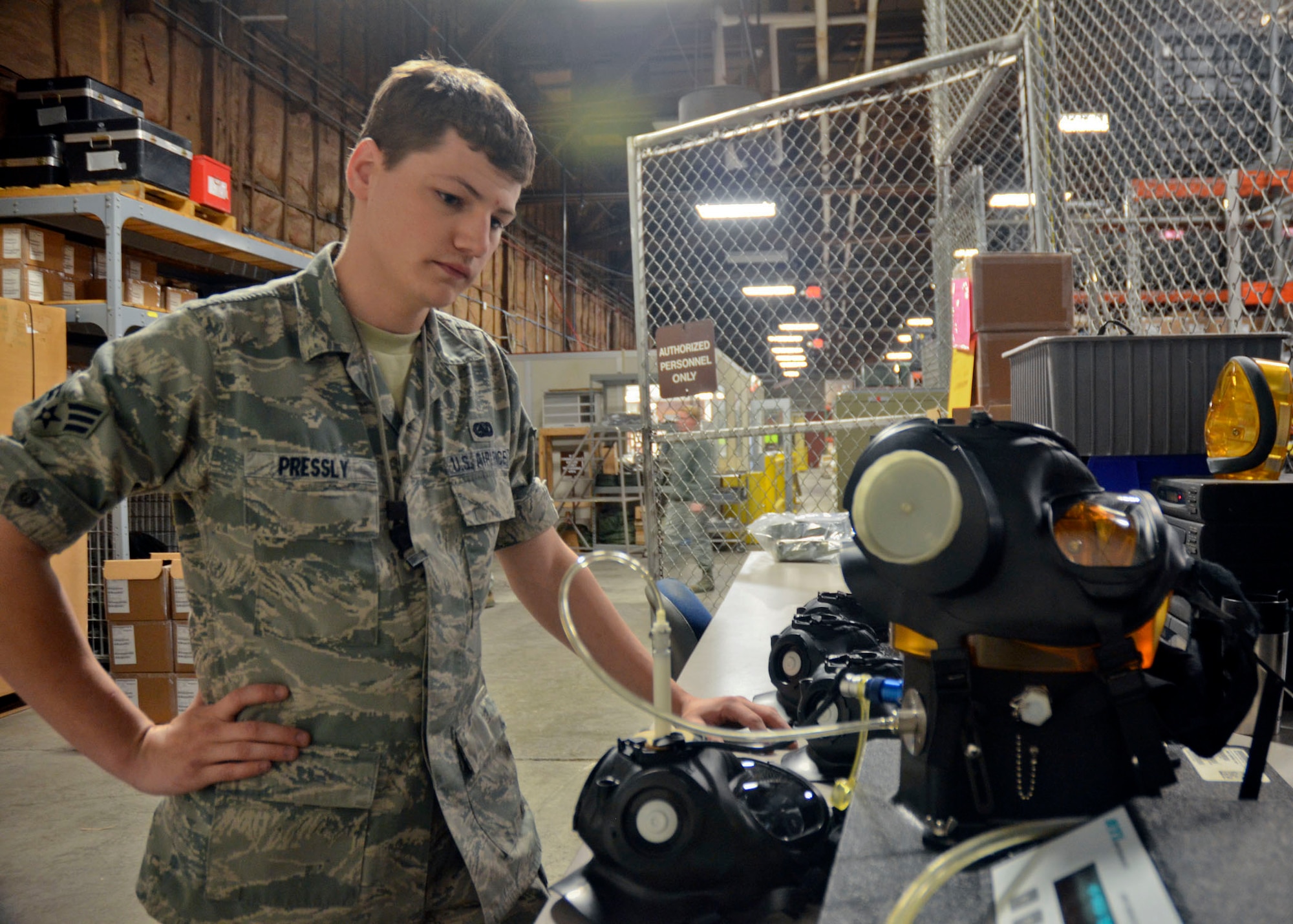 Missouri Air National Guard Senior Airman Jeremiah Pressly, of the 131st Logstics Readiness Squadron, tests gas masks that will be issued members of the 131st Bomb Wing during the unit training assembly May 4. (U.S. Air National Guard photo by Staff Sgt. Sean Navarro/RELEASED)