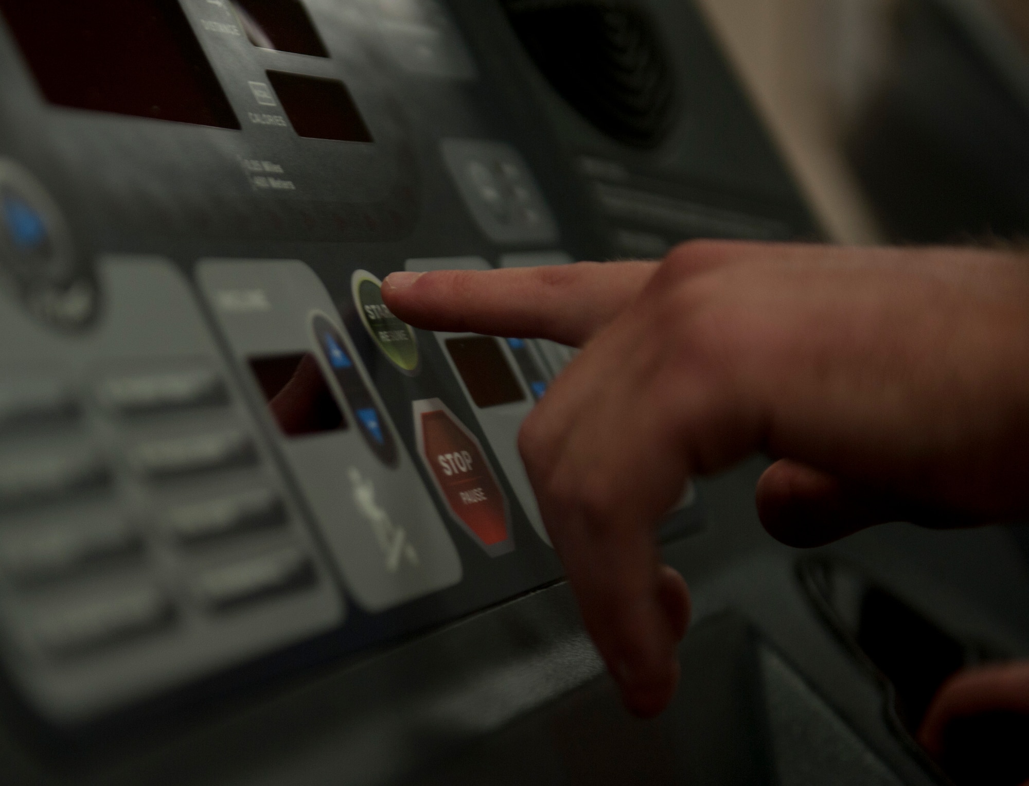 U.S. Air Force Airman1st Class Shane M. Phipps, 366th Fighter Wing public affairs photojournalist, pushes the start button on the treadmill to begin his run, May 7, 2013, at Mountain Home Air Force Base, Idaho. It’s important to maintain physical fitness in the military. (U.S. Air Force photo by Senior Airman Heather Hayward/Released) 