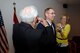 Spouse Cheri Champagne and father Richard Champagne proudly pin silver stars onto newly promoted Brig. Gen. Greg Champagne's uniform jacket, at Ike Skelton Training Site, May 4. Champagne, most recently 131st Bomb Wing, Missouri Air National Guard, wing commander, recently assumed the role of Assistant Adjutant General for Air at Missouri National Guard State Headquarters in Jefferson City.  (Missouri National Guard photo by SGT Katherine Sale/RELEASED)