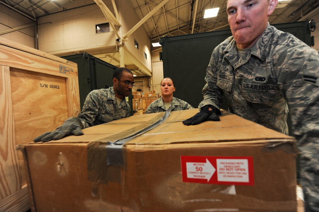 Airman 1st Class Jordan Fishburne, Senior Airman Brenda Hawkins and Airman 1st Class Brandon Scott, 28th Logistics Readiness Squadron aircraft parts technicians, add a B-1 part to a pallet while taking inventory in the Aircraft Parts Store on Ellsworth Air Force Base, S.D., April 30, 2013. The shop has several mobility readiness spares packages on hand that include numerous B-1 parts to ensure maintainers are able to prepare aircraft for taskings anywhere around the world. (U.S. Air Force photo by Airman 1st Class Kate Thornton-Maurer/Released) 