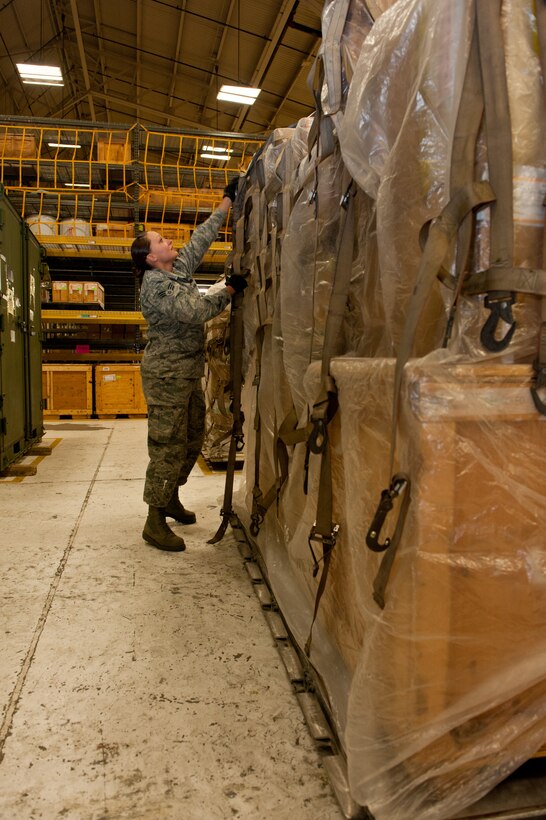 Senior Airman Brenda Hawkins, 28th Logistics Readiness Squadron aircraft parts technician, removes a top-net from a pallet while taking inventory in the Aircraft Parts Store on Ellsworth Air Force Base, S.D., April 30, 2013. Each pallet contains a variety of B-1 aircraft parts that must be secured to protect them during transit to bases around the world. (U.S. Air Force photo by Airman 1st Class Kate Thornton-Maurer/Released)
