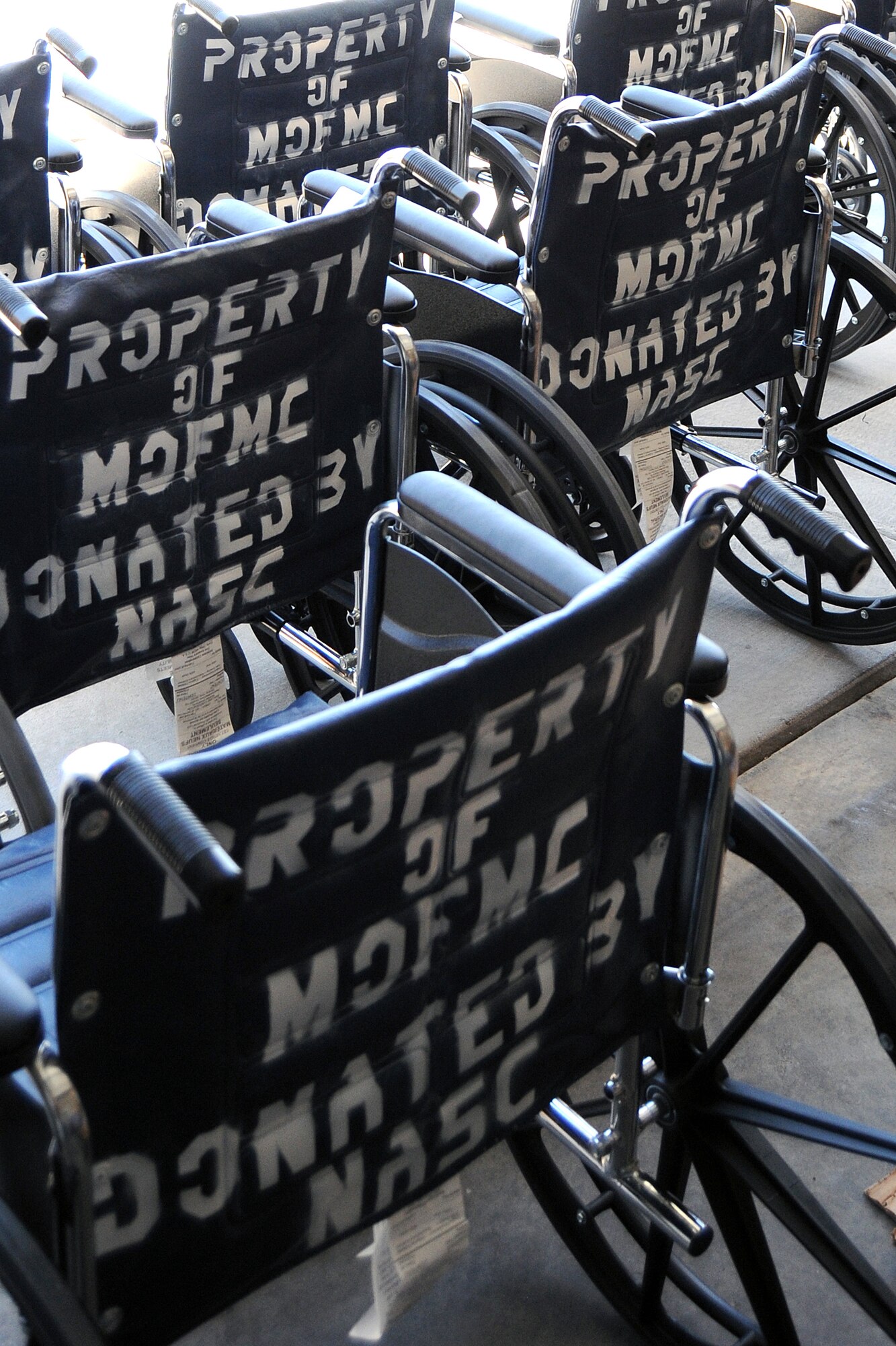 The Nellis Area Spouses’ Club donated thirty wheelchairs to the Mike O’Callaghan Federal Medical Center May 1, 2013. The club was able to donate the chairs from funds generated at their thrift shop on base. (Courtesy photo)