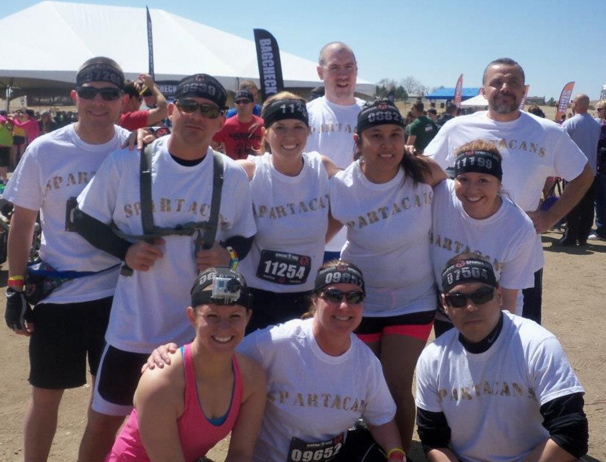 Members of the Air Reserve Personnel Center Spartan Team pose for a group photo before competition at Fort Carson, May 4.  From left to right beginning with row one:  Samantha Cavanagh, Maj. Susan Murphy, Louis Deanda; second row:  Master Sgt. Keith McKinion, Capt. Shannon Walker, Stephanie Blackwell, Diana Villegas; third row: William Clark, Staff Sgt. Kyle Carpenter, and Tony Cervantes.  (U.S. Air Force photo/Phil Burrell)