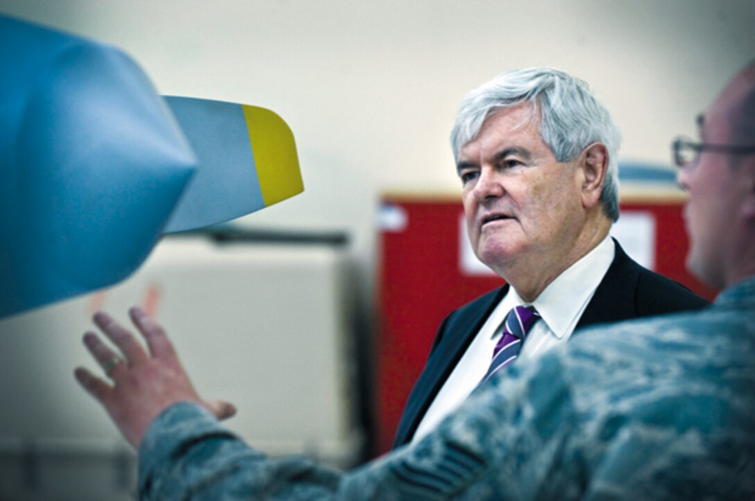 Newt Gingrich, former speaker of the U.S. House of Representatives, is briefed by Tech. Sgt. Christopher Delucia, Detachment 13 MQ-1 Predator maintenance instructor, April 24 at Nellis Air Force Base, Nev. Gingrich visited the United States Air Force Warfare Center, Detachment 13, the 26th Weapons Squadron and the United States Air Force Weapons School to learn about the various missions here. (U.S. Air Force photo by Airman 1st Class Jason Couillard)
