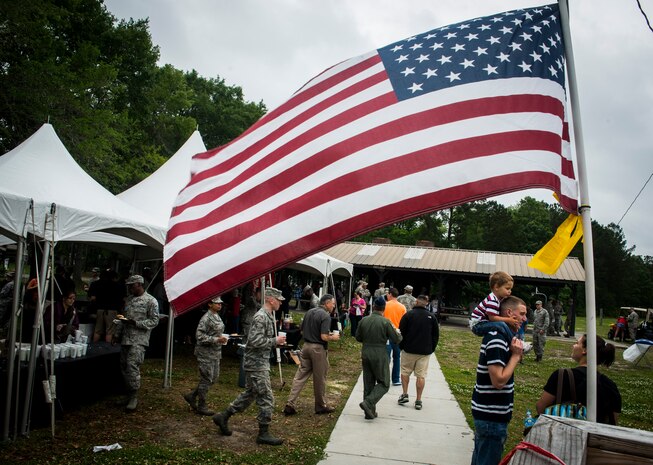 Members of Joint Base Charleston and their families enjoy free food and listen to a live band May 3, 2013, at the Joint Base Charleston Base Picnic. The base picnic was a free two-day event which included arts and crafts as well as slides and obstacle courses. (U.S. Air Force photo/ Senior Airman Dennis Sloan)