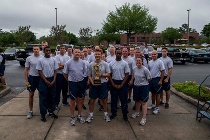 Members of the 628th Logistics Readiness Squadron pose for a group photo after the Commander’s Challenge Run May 3, 2013, at Joint Base Charleston – Air Base, S.C. The Commander's Challenge is held monthly to test Team Charleston's fitness abilities. The Spirit Award was given to the 628th LRS. (U.S. Air Force photo/ Senior Airman George Goslin)