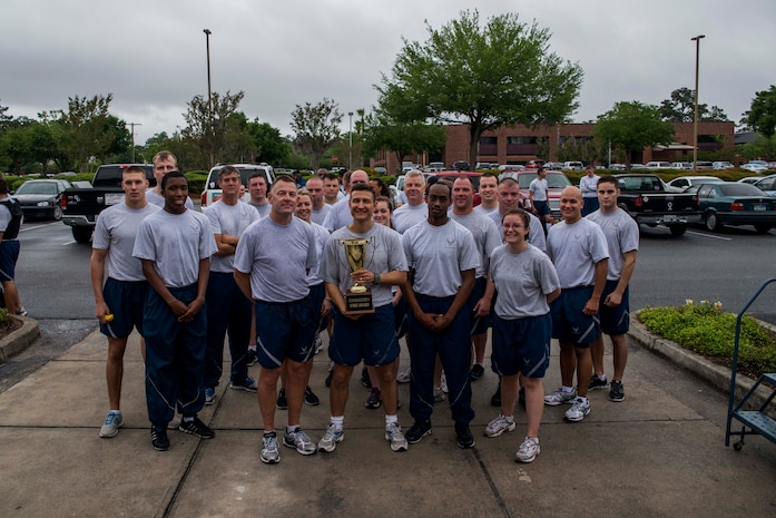 Members of the 628th Logistics Readiness Squadron pose for a group photo after the Commander’s Challenge Run May 3, 2013, at Joint Base Charleston – Air Base, S.C. The Commander's Challenge is held monthly to test Team Charleston's fitness abilities. The Spirit Award was given to the 628th LRS. (U.S. Air Force photo/ Senior Airman George Goslin)