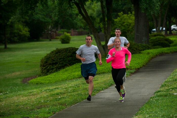 Heather Coffman, 628th Force Support Squadron services technician, runs towards the finish line during the Commander’s Challenge Run May 3, 2013, at Joint Base Charleston – Air Base, S.C. The Commander's Challenge is held monthly to test Team Charleston's fitness abilities. Coffman was the top female runner with a time of 20:59. (U.S. Air Force photo/ Senior Airman George Goslin)