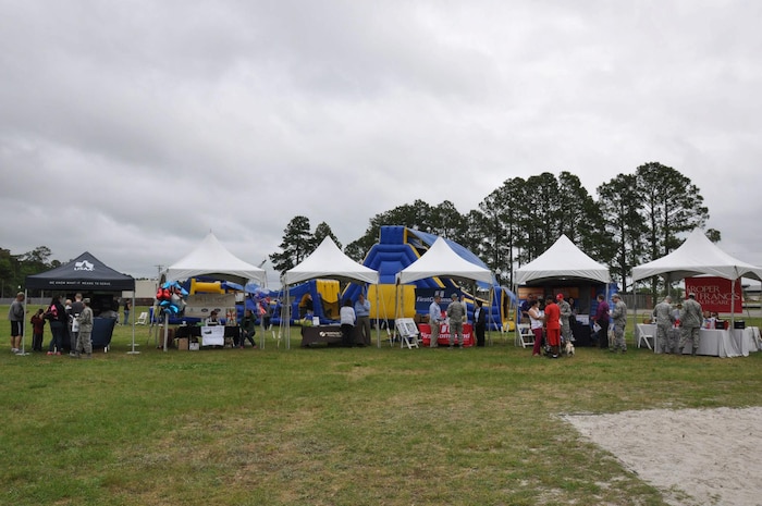 Service members and their families enjoy the food and outdoor activities at the Joint Base Charleston Picnic May 4, 2013. The base picnic was a free two-day event which included free food, drinks and a live band for all Team Charleston members and their families to enjoy. (U.S. Air Force photo/Senior Airman Bobby Pilch)